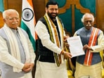 Haryana CM Nayab Saini (centre) with Governor Bandaru Dattatraya and ML Khattar on Tuesday. Haryana CM Nayab Saini (centre) with Governor Bandaru Dattatraya and ML Khattar on Tuesday.