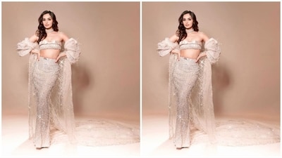 For a little extra drama, she added a cape over her ensemble, which features a shimmering sheer fabric and extends all the way to the floor, adding a touch of glamour. Her mesmerising outfit is from the shelves of Falguni Shane Peacock India. (Instagram/@manushi_chhillar) For a little extra drama, she added a cape over her ensemble, which features a shimmering sheer fabric and extends all the way to the floor, adding a touch of glamour. Her mesmerising outfit is from the shelves of Falguni Shane Peacock India. (Instagram/@manushi_chhillar)