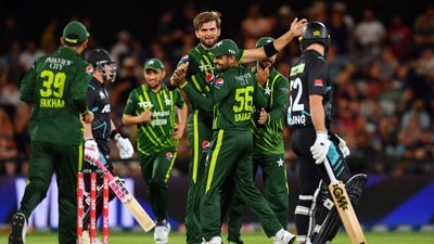 Pakistan's T20I captain Shaheen Shah Afridi (C) celebrates with former captain Babar Azam after the wicket of New Zealand's Tim Seifert during NZ T20I series (AFP)