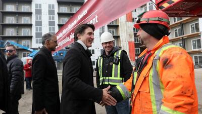 Canada’s Prime Minister Justin Trudeau meets workers as he tours new construction at Edgemont Flats housing complex during an announcement of new funding for housing in Edmonton, Alberta. (REUTERS) Canada’s Prime Minister Justin Trudeau meets workers as he tours new construction at Edgemont Flats housing complex during an announcement of new funding for housing in Edmonton, Alberta. (REUTERS)