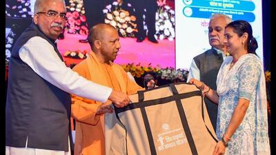 Chief minister Yogi Adityanath gives a toolkit to a beneficiary during the mega loan distribution programme for the Micro, Small and Medium Enterprises (MSME) sector, at Lok Bhawan, in Lucknow on Wednesday. (ANI Photo) Chief minister Yogi Adityanath gives a toolkit to a beneficiary during the mega loan distribution programme for the Micro, Small and Medium Enterprises (MSME) sector, at Lok Bhawan, in Lucknow on Wednesday. (ANI Photo)