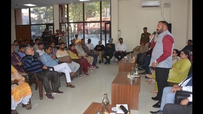 Mayor Kuldeep Kumar Dhalor addressing residents during ‘Mayor Aapke Dwar’ programme at Chandigarh. (Sant Arora /HT)