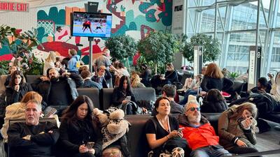 Passengers wait for their flights at Montreal-Pierre Elliott Trudeau International Airport in Montreal, Canada. (AFP) Passengers wait for their flights at Montreal-Pierre Elliott Trudeau International Airport in Montreal, Canada. (AFP)