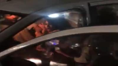 In the video, some unidentified women can be seen roughing up the BRS corporator sitting in the front seat of her car. (ANI) In the video, some unidentified women can be seen roughing up the BRS corporator sitting in the front seat of her car. (ANI)