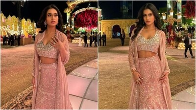 Meanwhile, the lehenga skirt Nysa wore features a high-rise waist, sequin and gemstone embellishments, a mermaid silhouette, and a floor-length hem with a scalloped design. For accessories, Nysa chose diamond rings and statement earrings, and for the glam, she opted for loose locks styled in voluminous waves, mascara on the lashes, darkened brows, metallic gold nails, berry lip shade, and rouge on the cheeks. (Instagram) Meanwhile, the lehenga skirt Nysa wore features a high-rise waist, sequin and gemstone embellishments, a mermaid silhouette, and a floor-length hem with a scalloped design. For accessories, Nysa chose diamond rings and statement earrings, and for the glam, she opted for loose locks styled in voluminous waves, mascara on the lashes, darkened brows, metallic gold nails, berry lip shade, and rouge on the cheeks. (Instagram)