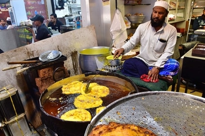Enjoy your malpuas with a dollop of cream and nuts (Bhushan Koyande/ HT) Enjoy your malpuas with a dollop of cream and nuts (Bhushan Koyande/ HT)