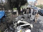 Lebanese army soldiers stand next to a destroyed car in the southern outskirts of Tyre, Lebanon. (AP) Lebanese army soldiers stand next to a destroyed car in the southern outskirts of Tyre, Lebanon. (AP)