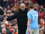 Manchester City's Kevin De Bruyne with manager Pep Guardiola after being substituted 