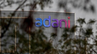 Adani Share Price today: The logo of the Adani Group seen on the facade of its Corporate House on the outskirts of Ahmedabad. (Reuters)
