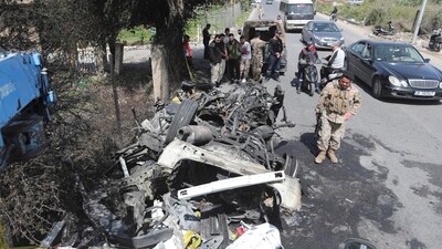 Lebanese army soldiers stand next to a destroyed car in the southern outskirts of Tyre, Lebanon. (AP) Lebanese army soldiers stand next to a destroyed car in the southern outskirts of Tyre, Lebanon. (AP)