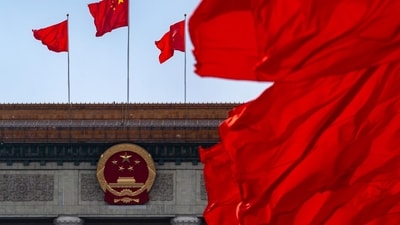 A Chinese national flag at the Great Hall of the People following the closing of the Second Session of the 14th National People's Congress (NPC) in Beijing, China, on Monday, March 11, 2024. The Chinese legislature voted to change a four-decade-old law so it tightens the Communist Party's grip on the cabinet, underscoring President Xi Jinping's drive to give the party control over all the main levers of government. Source: Bloomberg (Bloomberg) A Chinese national flag at the Great Hall of the People following the closing of the Second Session of the 14th National People's Congress (NPC) in Beijing, China, on Monday, March 11, 2024. The Chinese legislature voted to change a four-decade-old law so it tightens the Communist Party's grip on the cabinet, underscoring President Xi Jinping's drive to give the party control over all the main levers of government. Source: Bloomberg (Bloomberg)