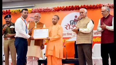 Chief minister Yogi Adityanath distributing appointment letters to those selected by the UP Public Service Commission, at his official residence in Lucknow on Thursday. (HT Photo) Chief minister Yogi Adityanath distributing appointment letters to those selected by the UP Public Service Commission, at his official residence in Lucknow on Thursday. (HT Photo)