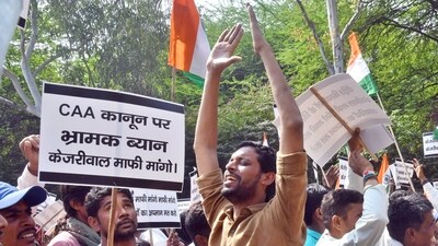 Hindu and Sikh refugees raise slogans during a protest against Delhi CM Arvind Kejriwal demanding an apology from him over his statements against the implementation of the Citizenship (Amendment) Act (CAA), near his residence at Civil Lines area, in New Delhi, India, on Thursday, March 14, 2024. (Photo by Sanjeev Verma/ Hindustan Times) Hindu and Sikh refugees raise slogans during a protest against Delhi CM Arvind Kejriwal demanding an apology from him over his statements against the implementation of the Citizenship (Amendment) Act (CAA), near his residence at Civil Lines area, in New Delhi, India, on Thursday, March 14, 2024. (Photo by Sanjeev Verma/ Hindustan Times)