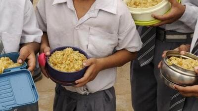 School students with their midday meal. (HT File Photo) School students with their midday meal. (HT File Photo)