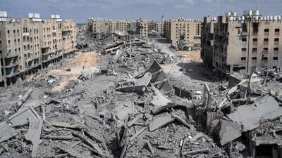 Displaced Palestinians walk amid the rubble of houses destroyed by Israeli bombardment in Hamad area, west of Khan Yunis in the southern Gaza Strip. (AFP) Displaced Palestinians walk amid the rubble of houses destroyed by Israeli bombardment in Hamad area, west of Khan Yunis in the southern Gaza Strip. (AFP)