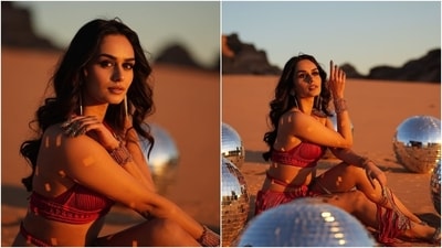 Manushi Chhillar posted the photos with the caption, "Wallah Habibing through my Wednesday. #BadeMiyanChoteMiyan." While her red bikini top features a halter plunging neckline, rope thread embellishments, a cropped hem, and a fitted bust, the see-through skirt has tassels and a mesh underskirt. The former Miss World accessorised the outfit with gilded nail rings, gold bracelets, anklets with attached toe rings, and dangling earrings. (Instagram) Manushi Chhillar posted the photos with the caption, "Wallah Habibing through my Wednesday. #BadeMiyanChoteMiyan." While her red bikini top features a halter plunging neckline, rope thread embellishments, a cropped hem, and a fitted bust, the see-through skirt has tassels and a mesh underskirt. The former Miss World accessorised the outfit with gilded nail rings, gold bracelets, anklets with attached toe rings, and dangling earrings. (Instagram)