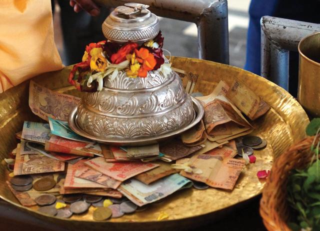 In 2021-22, Indian households donated mostly cash, to religious organisations. (Shutterstock) In 2021-22, Indian households donated mostly cash, to religious organisations. (Shutterstock)