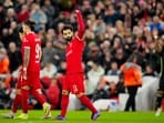 Liverpool's Mohamed Salah celebrates after scoring his side's third goal.