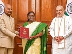 Former President Ram Nath Kovind with President Droupadi Murmu and Union home minister Amit Shah in New Delhi on Thursday. (PTI)