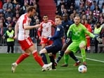 Bayern Munich's Harry Kane scores in a Bundesliga match.