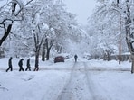 People walk during a snowstorm in Boulder, Colorado. The National Weather Service predicts as much as two feet of snow in the front range region of the state. Travel chaos in Colorado amid heavy snowstorm: Travellers stranded as highway shutdown, flights cancelled 