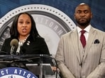 Fulton County District Attorney Fani Willis speaks at a press conference next to prosecutor Nathan Wade after a Grand Jury brought back indictments against former president Donald Trump and his allies in their attempt to overturn the state's 2020 election results, in Atlanta, Georgia, U.S. August 14, 2023. REUTERS/Elijah Nouvelage/File Photo