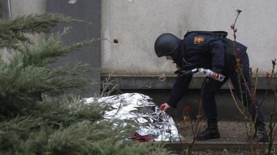 An emergency worker inspects the body of a killed person at the site of a Russian missile strike, amid Russia's attack on Ukraine, in Odesa, Ukraine March 15. (REUTERS) An emergency worker inspects the body of a killed person at the site of a Russian missile strike, amid Russia's attack on Ukraine, in Odesa, Ukraine March 15. (REUTERS)
