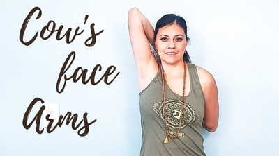 9. Cow Face Pose (Gomukhasana Arms): Sit tall with your legs crossed and one arm extended overhead, palm facing down. Bend your elbow and reach your hand down your back, palm facing outward. Use your other hand to reach behind your back and clasp the fingers of both hands together. Feel the stretch in your shoulders and arms as you hold the pose, then switch sides. (Photo by Twitter/BornToBirthYoga) 9. Cow Face Pose (Gomukhasana Arms): Sit tall with your legs crossed and one arm extended overhead, palm facing down. Bend your elbow and reach your hand down your back, palm facing outward. Use your other hand to reach behind your back and clasp the fingers of both hands together. Feel the stretch in your shoulders and arms as you hold the pose, then switch sides. (Photo by Twitter/BornToBirthYoga)