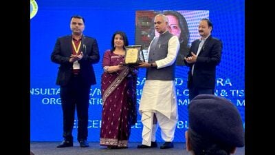 Gujarat governor Acharya Devvrat felicitating achievers during an event organised by MFI and PRCI at a hotel in Chandigarh on Friday. (HT Photo)