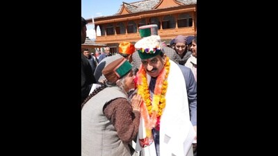 Himachal chief minister Sukhvinder Singh Sukhu interacting with an elderly woman during a public meeting at Rampur on Friday. (HT Photo)