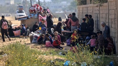 Residents of the Qatari-funded Hamad Town residential complex in Khan Yunis in the southern Gaza Strip. (AFP) Residents of the Qatari-funded Hamad Town residential complex in Khan Yunis in the southern Gaza Strip. (AFP)
