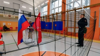 A man casts his ballot in Russia's presidential election in Saint Petersburg on March 15, 2024. (AFP) A man casts his ballot in Russia's presidential election in Saint Petersburg on March 15, 2024. (AFP)