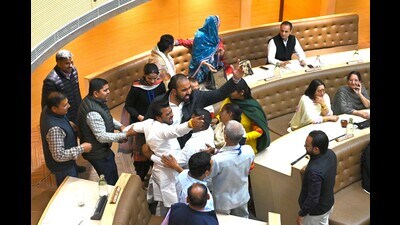 Suspended BJP councillors being marshaled out during the special House meeting at MC office on Friday. (Keshav Singh/ HT) Suspended BJP councillors being marshaled out during the special House meeting at MC office on Friday. (Keshav Singh/ HT)