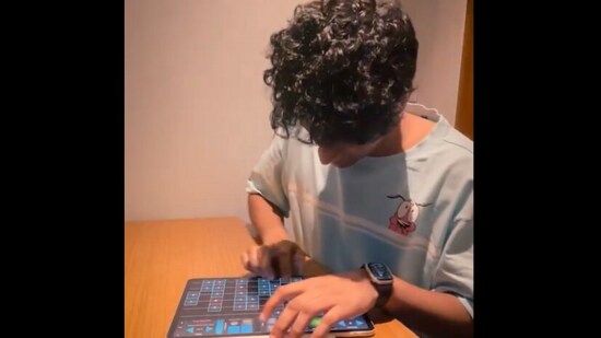 The image is taken from a video shared by Anand Mahindra that shows Mahesh Raghvan playing classical music on an iPad. (X/@anandmahindra)