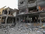 Palestinians search the rubble of a family home following Israeli bombardment west of the Nuseirat refugee camp in the central Gaza Strip. (AFP) Palestinians search the rubble of a family home following Israeli bombardment west of the Nuseirat refugee camp in the central Gaza Strip. (AFP)