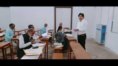 Evaluation of UP Board answer sheets underway at an evaluation centre in Prayagraj on Saturday. (HT Photo) Evaluation of UP Board answer sheets underway at an evaluation centre in Prayagraj on Saturday. (HT Photo)