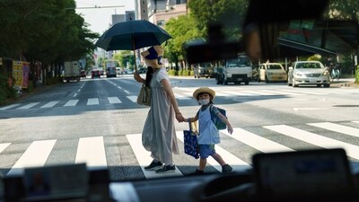 FILE - A pedestrian crossing a street with a child is seen through a taxi window in Tokyo, Monday, July 19, 2021. The number of babies born in Japan last year fell for an eighth straight year to a new low, government data showed Tuesday, Feb. 27, 2024, and a top official said it was critical for the country to reverse the trend in the coming half-dozen years. (AP Photo/David Goldman, File) (AP) FILE - A pedestrian crossing a street with a child is seen through a taxi window in Tokyo, Monday, July 19, 2021. The number of babies born in Japan last year fell for an eighth straight year to a new low, government data showed Tuesday, Feb. 27, 2024, and a top official said it was critical for the country to reverse the trend in the coming half-dozen years. (AP Photo/David Goldman, File) (AP)