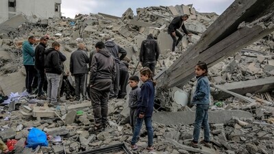 Palestinians inspect the rubble of a building, after it was destroyed in an Israeli strike the night before, in the Rimal neighbourhood of Gaza City. (AFP) Palestinians inspect the rubble of a building, after it was destroyed in an Israeli strike the night before, in the Rimal neighbourhood of Gaza City. (AFP)