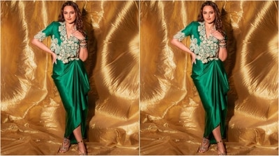 Her outfit is an enchanting shade of green and features a cropped jacket embroidered all over with intricate gold embroidery. Paired with a matching satin skirt with dramatic draping, it is the perfect blend of style and trend.&nbsp; (Instagram/@aslisona)