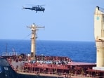 Pirates detained by the Indian navy during a rescue operation for the hijacked ship MV Ruen sit on the deck in this handout image released on March 16, 2024. Spokespersonnavy via X/Handout via REUTERS.