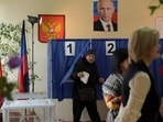 A man votes in Russia's presidential election at a polling station in Donetsk, Russian-controlled Ukraine, amid the Russia-Ukraine conflict on March 16, 2024. A man votes in Russia's presidential election at a polling station in Donetsk, Russian-controlled Ukraine, amid the Russia-Ukraine conflict on March 16, 2024.