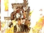PM Modi urges people to come down from light tower in Andhra Pradesh.