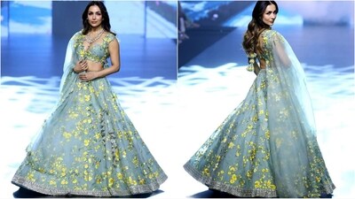 Malaika Arora walked the ramp as showstopper for Anushree Reddy and Ritika Mirchandani and left her fans in awe of her stunning look. Her outfit was all about floral elegance and style as she donned a plunging neckline bralette adorned with yellow floral embellishments. She paired it with a matching lehenga skirt and dupatta to complete her look. With a multi-layered diamond necklace, subtle make-up and loose hair, she owned the ramp. (Instagram/@lakmefashionwk) Malaika Arora walked the ramp as showstopper for Anushree Reddy and Ritika Mirchandani and left her fans in awe of her stunning look. Her outfit was all about floral elegance and style as she donned a plunging neckline bralette adorned with yellow floral embellishments. She paired it with a matching lehenga skirt and dupatta to complete her look. With a multi-layered diamond necklace, subtle make-up and loose hair, she owned the ramp. (Instagram/@lakmefashionwk)