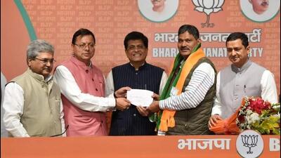 Congress MLA from Badrinath assembly constituency Rajendra Singh Bhandari joining the BJP in presence of Union minister Piyush Goyal and Uttarakhand chief minister Pushkar Singh Dhami in Delhi on Sunday. Congress MLA from Badrinath assembly constituency Rajendra Singh Bhandari joining the BJP in presence of Union minister Piyush Goyal and Uttarakhand chief minister Pushkar Singh Dhami in Delhi on Sunday.