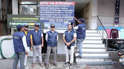 During the raid, officials put a display board of ‘notice of attachment’ In which it was mentioned, “This is to inform all members of the public, that the said flat being ‘Proceed of Terrorism’ stand attached under the provision of UAPA act 1967 in NIA case.’’ (ht photO)