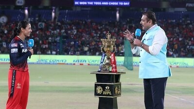 Former India head coach Ravi Shastri with RCB captain Smriti Mandhana at toss Former India head coach Ravi Shastri with RCB captain Smriti Mandhana at toss