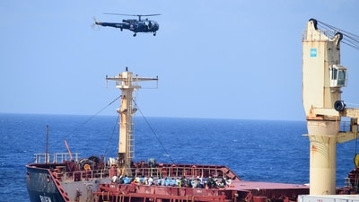 Pirates detained by the Indian navy during a rescue operation for the hijacked ship MV Ruen sit on the deck in this handout image released on March 16, 2024. Spokespersonnavy via X/Handout via REUTERS.