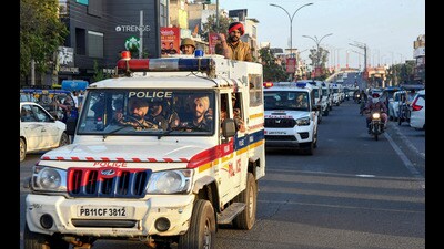 Security personnel conduct a flag march after the Model Code of Conduct was enforced following the announcement of the schedule of Lok Sabha elections, in Patiala. (PTI)