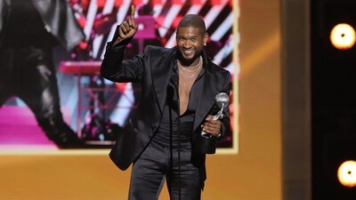 LOS ANGELES, CALIFORNIA - MARCH 16: Usher accepts the Entertainer of the Year award onstage during the 55th Annual NAACP Awards at the Shrine Auditorium and Expo Hall on March 16, 2024 in Los Angeles, California.   Kevin Winter/Getty Images/AFP (Photo by KEVIN WINTER / GETTY IMAGES NORTH AMERICA / Getty Images via AFP) (Getty Images via AFP)