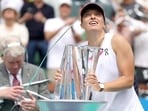 Iga Swiatek of Poland reacts as streamers are blasted off at the trophy ceremony after defeating Maria Sakkari of Greece during the Women's Final of the BNP Paribas Open at Indian Wells